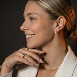 Gold Crystal Pavé Huggie Hoop Earrings with Hinged Closure