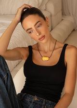 Gold Oval Pendant Necklace with Black Leather Cord