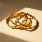 Gold Twisted Center Bangle Bracelet with Secure Clasp