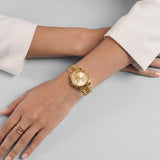 Gold Stainless Steel Analog Wristwatch with Champagne Dial